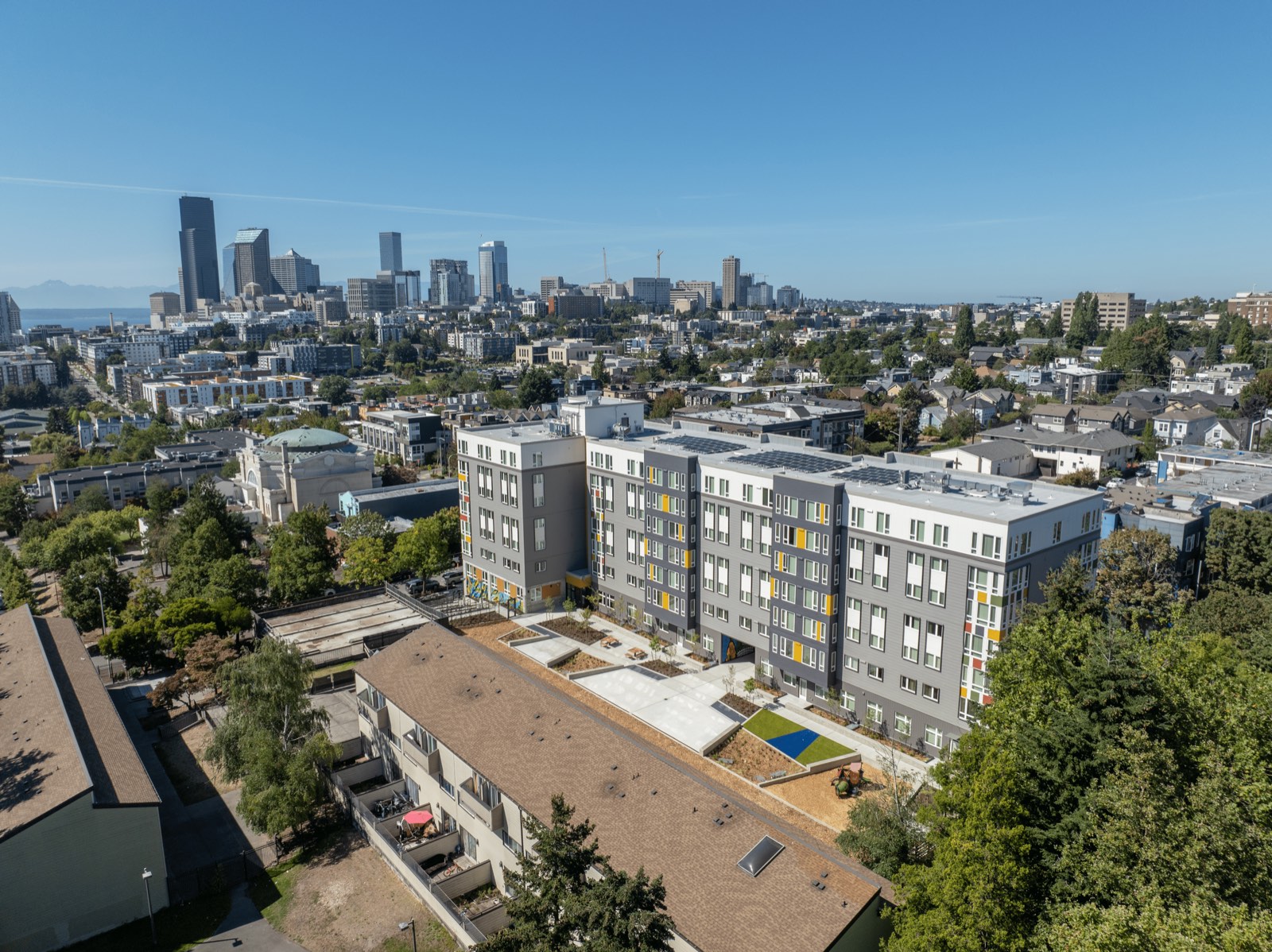 Aerial view of the Skyway 120 building within its surrounding neighborhood