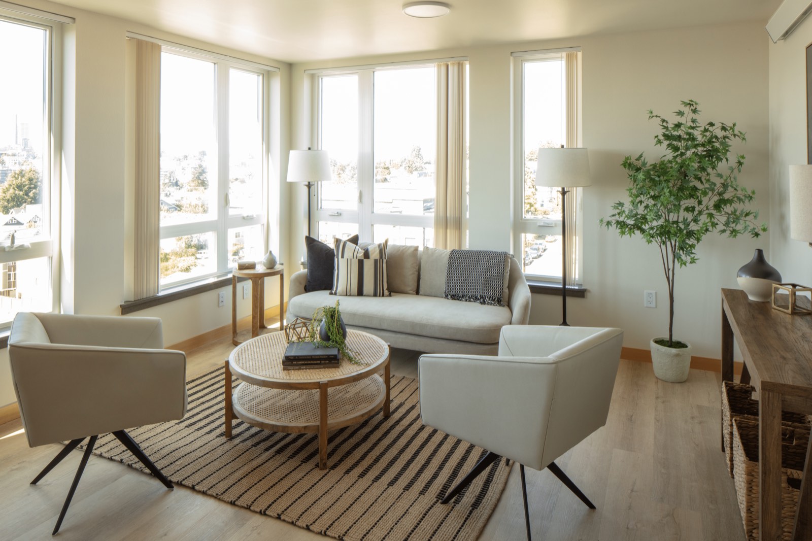 Model unit living room rendering with furnished seating area